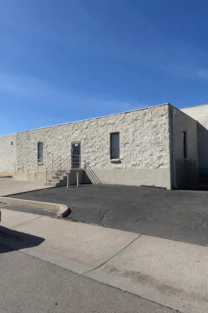 Exterior entrance of Spargo Collision Center on South Lipan Street in Denver