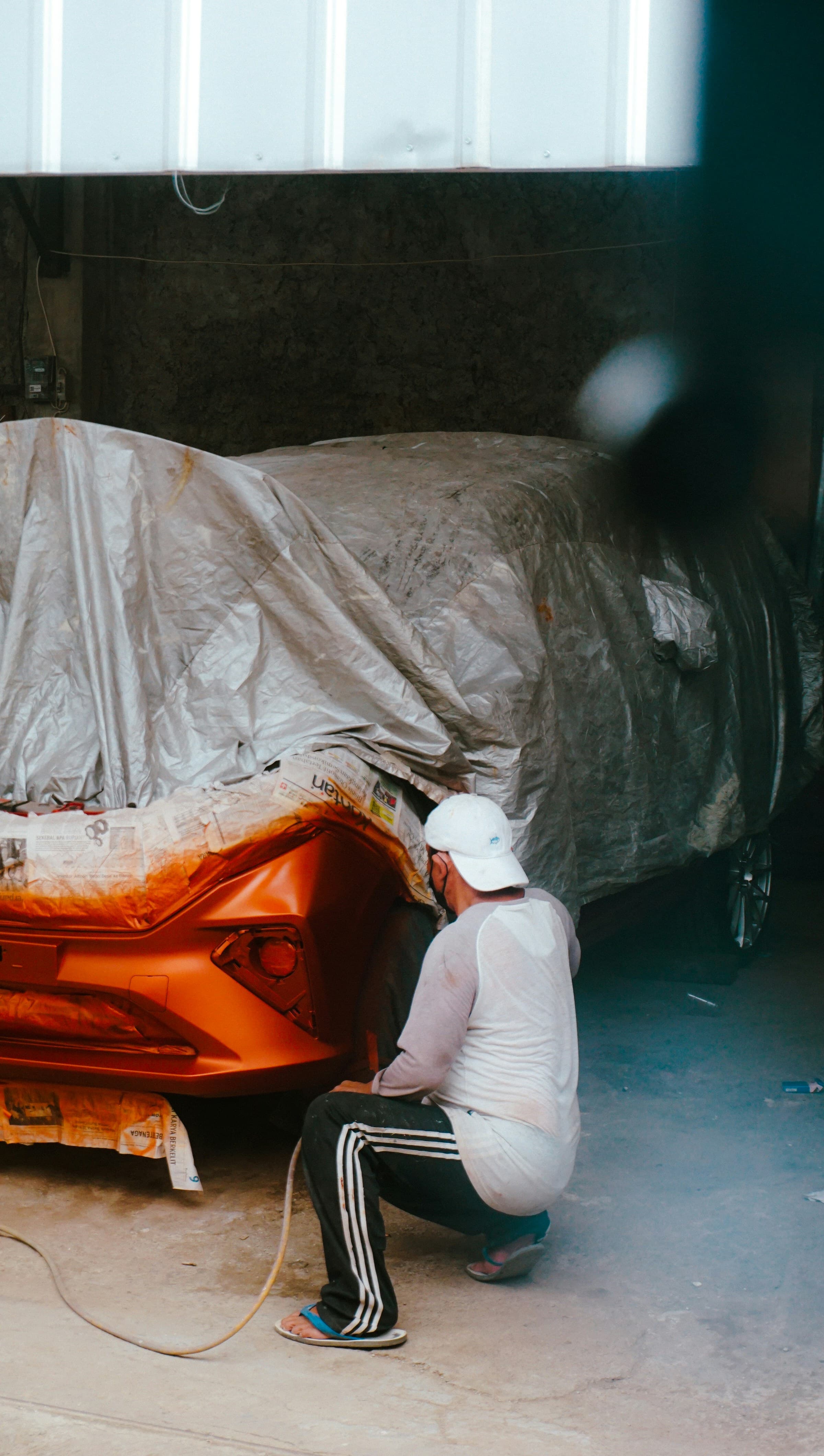 Spray painting a car part